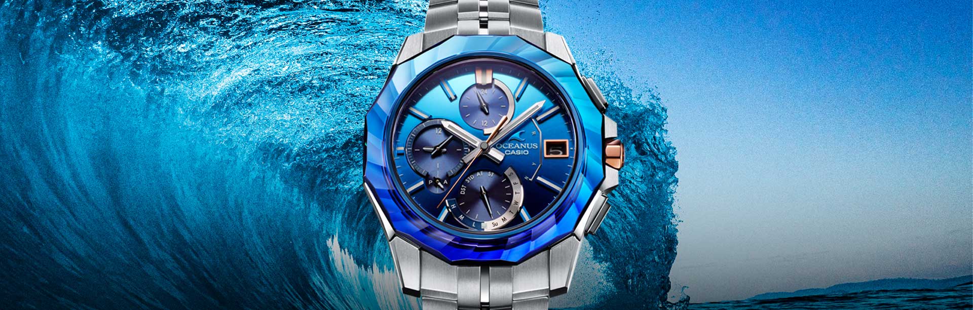 OCEANUS MANTA Series OCW-S6000SW Analog watch with blue bezel in front of a wave