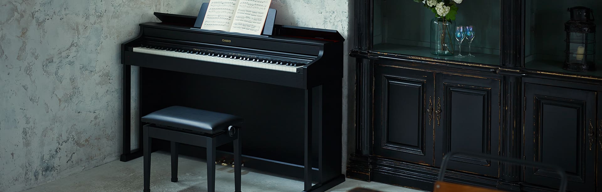Celviano AP-470 digital piano in corner of room next to wooden cabinet 3