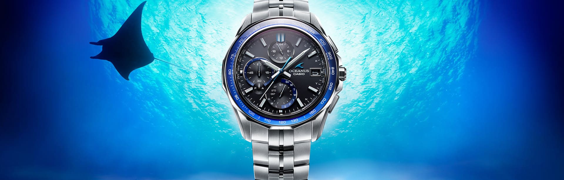 Blue OCEANUS OCWS7000 Analog watch in an under water setting with Sea Ray
